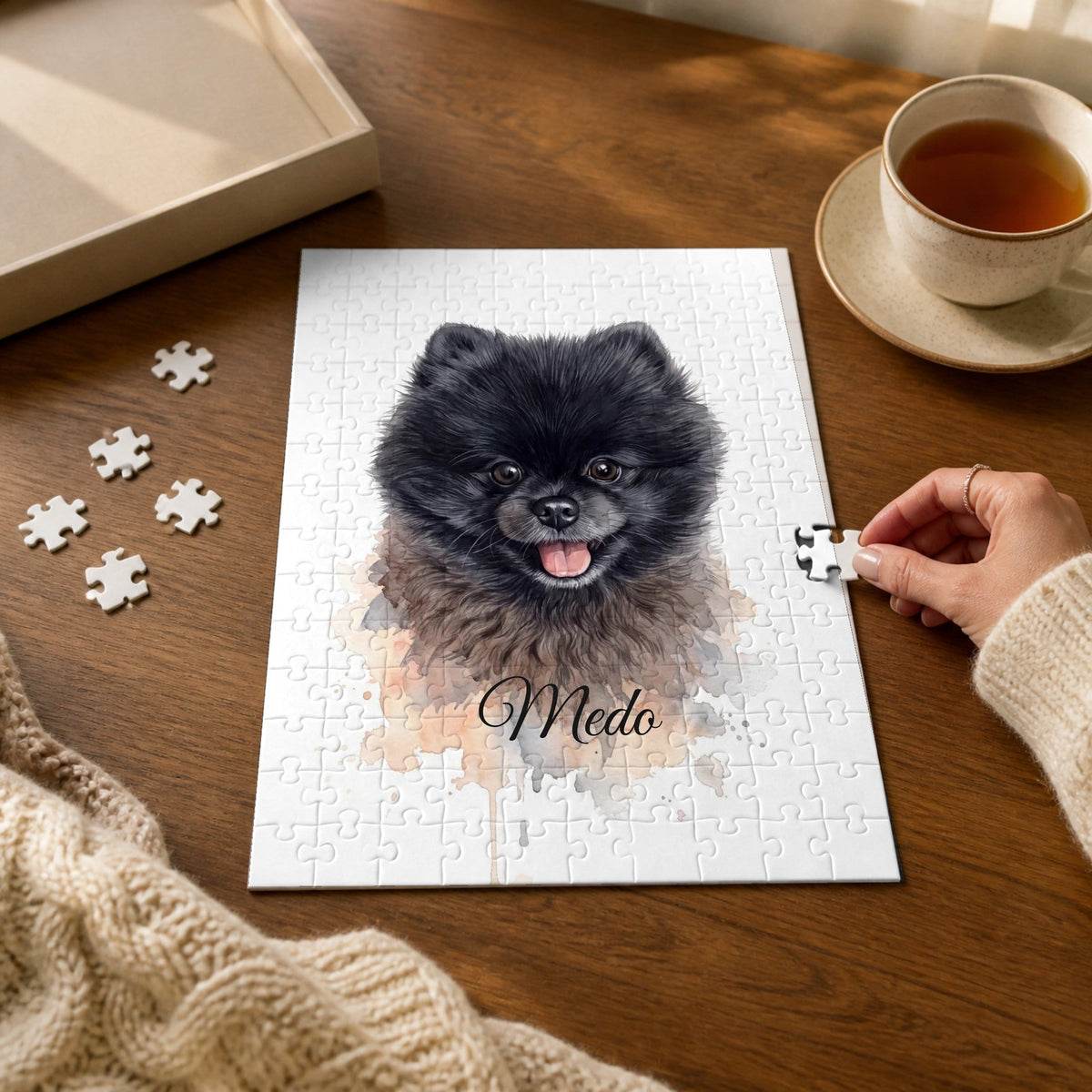 Personalised jigsaw puzzle with a watercolour portrait of a pet and its name on a wooden table